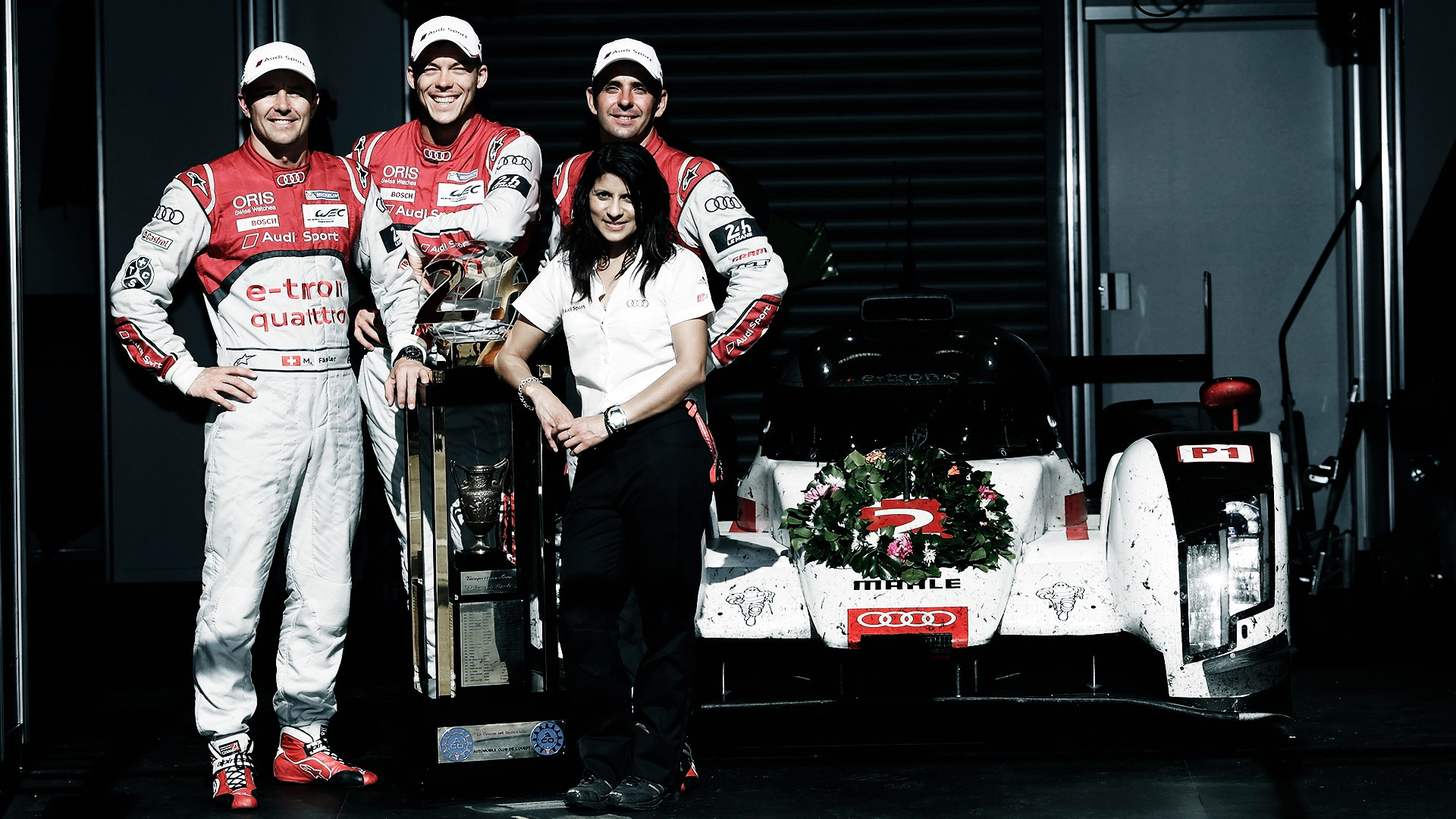 Marcel Fässler, André Lotterer, Leena Gade in Benoît Tréluyer z vozilom Audi R18 e-tron quattro.